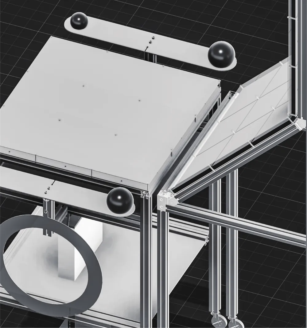 Rendered view of the 03 rig: an aluminium profile frame, a satin acrylic tabletop, black spherical handles and a folded display panel.